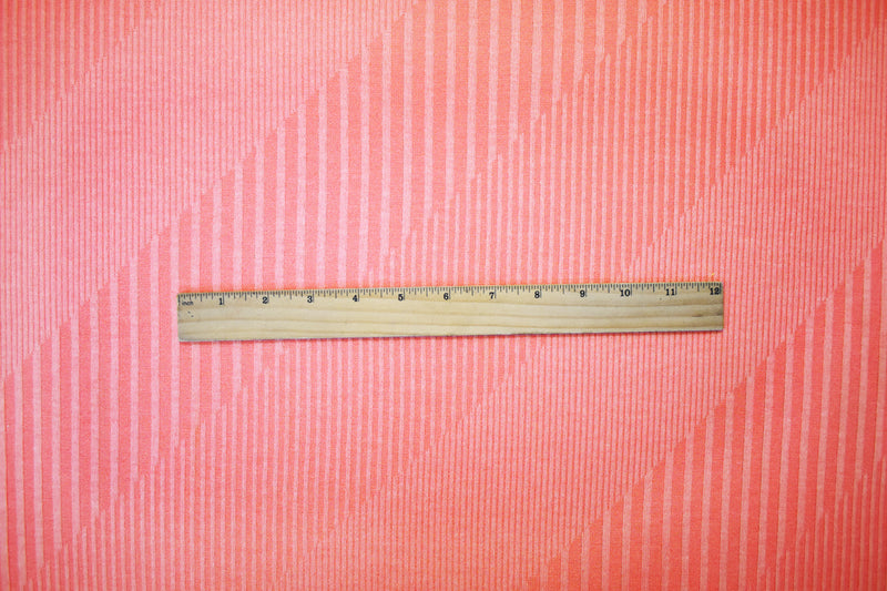 Coral Pink Poly Blend Stretch Irregular Rib Knit Fabric