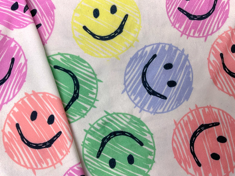 White-Pink-Multi Poly Stretch Smile Face Print Jersey Knit Fabric