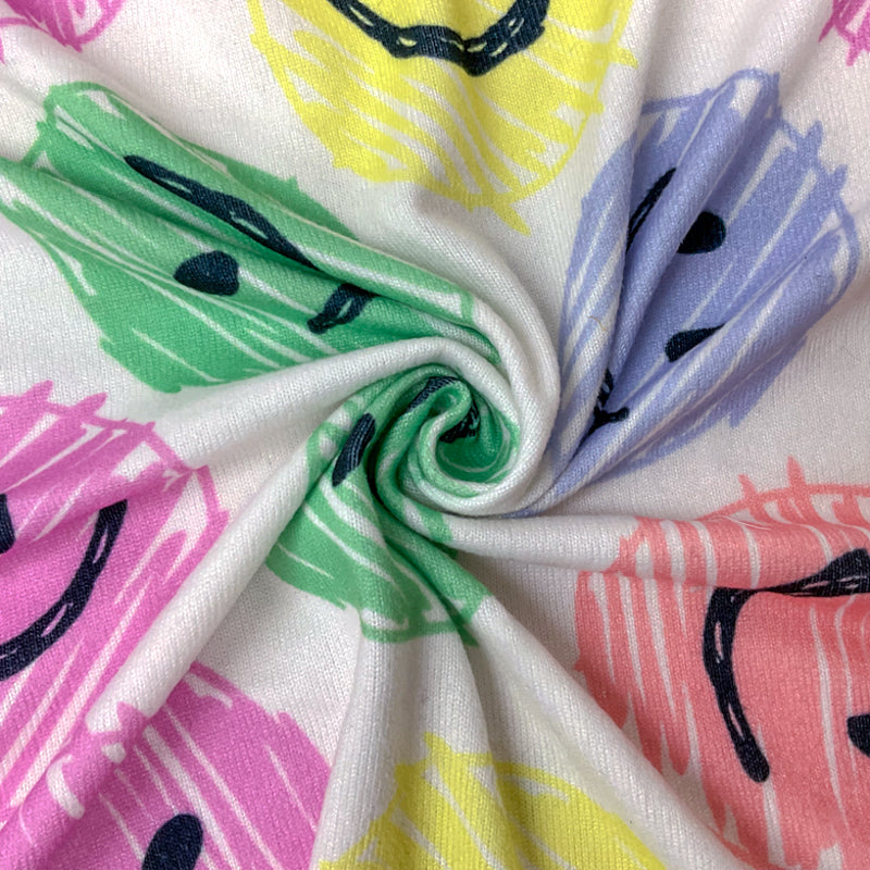 White-Pink-Multi Poly Stretch Smile Face Print Jersey Knit Fabric