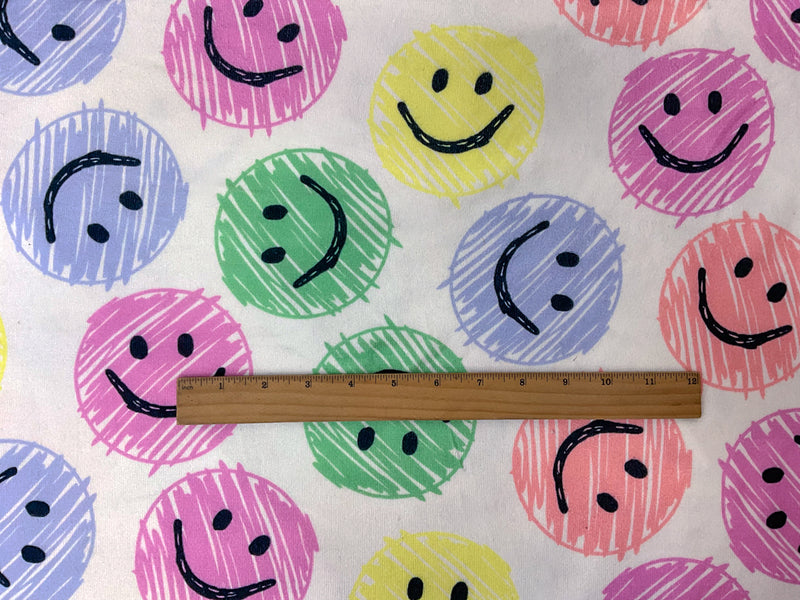 White-Pink-Multi Poly Stretch Smile Face Print Jersey Knit Fabric