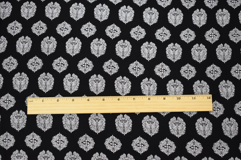 Black Rayon Famous Designer Crest Print Challis Woven Fabric